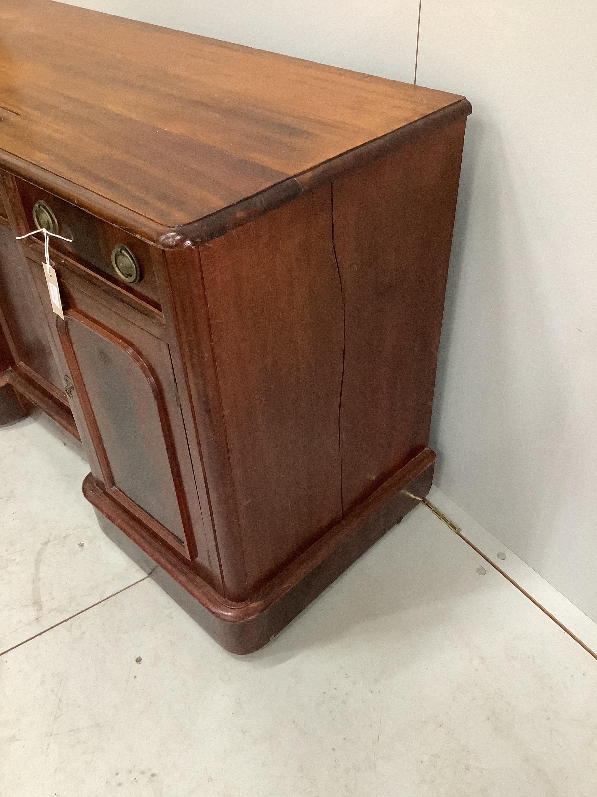 A Victorian inverse breakfront mahogany sideboard, width 124cm, depth 48cm, height 76cm